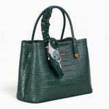 Green croc-effect tote bag, angled view showing the glossy croc-effect texture
