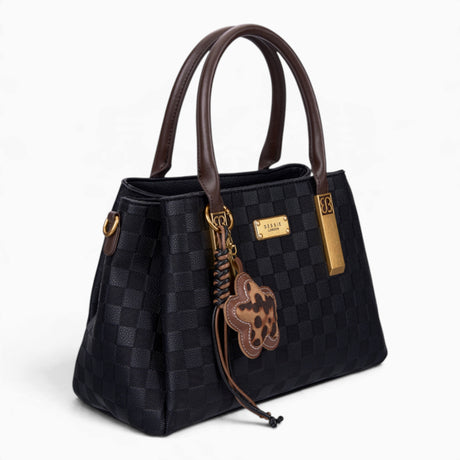 Black checkerboard tote bag, angled view showing the checkerboard pattern and charm