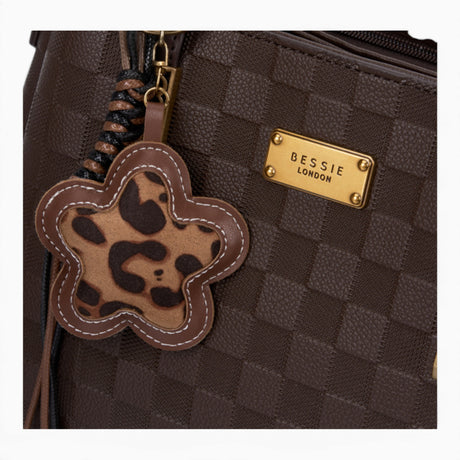 Coffee checkerboard tote bag, close-up of the checkerboard pattern and charm