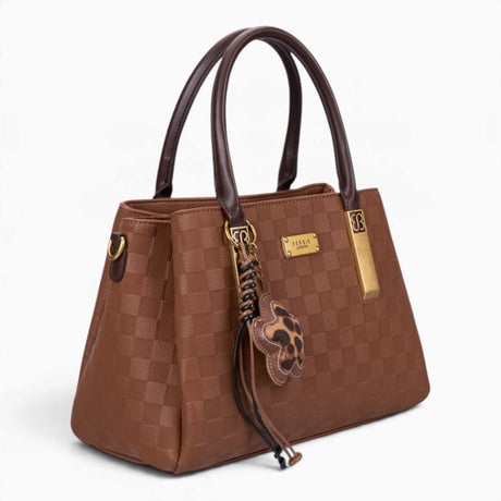 Tan checkerboard tote bag, angled view showing the checkerboard pattern and charm