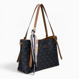 Black monogram shoulder bag, angled view showing the monogram print and scarf