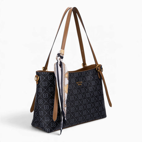 Black monogram shoulder bag, angled view showing the monogram print and scarf