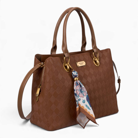 Tan monogram tote bag, angled view showing the monogram print and scarf