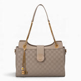 Taupe checkerboard shoulder bag with a flap-over front, chain and charm