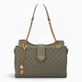 Green checkerboard shoulder bag with a flap-over front, chain and charm