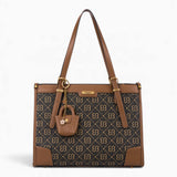 Tan monogram shoulder bag with a charm and top handles