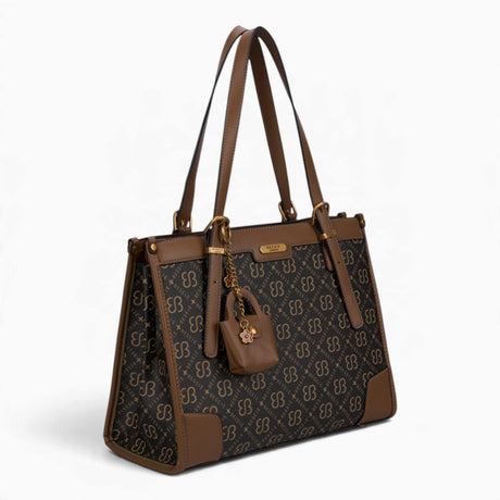 Tan monogram shoulder bag, angled view showing the monogram print and charm