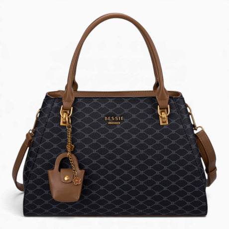Black sculpted monogram tote bag with a charm and double handles