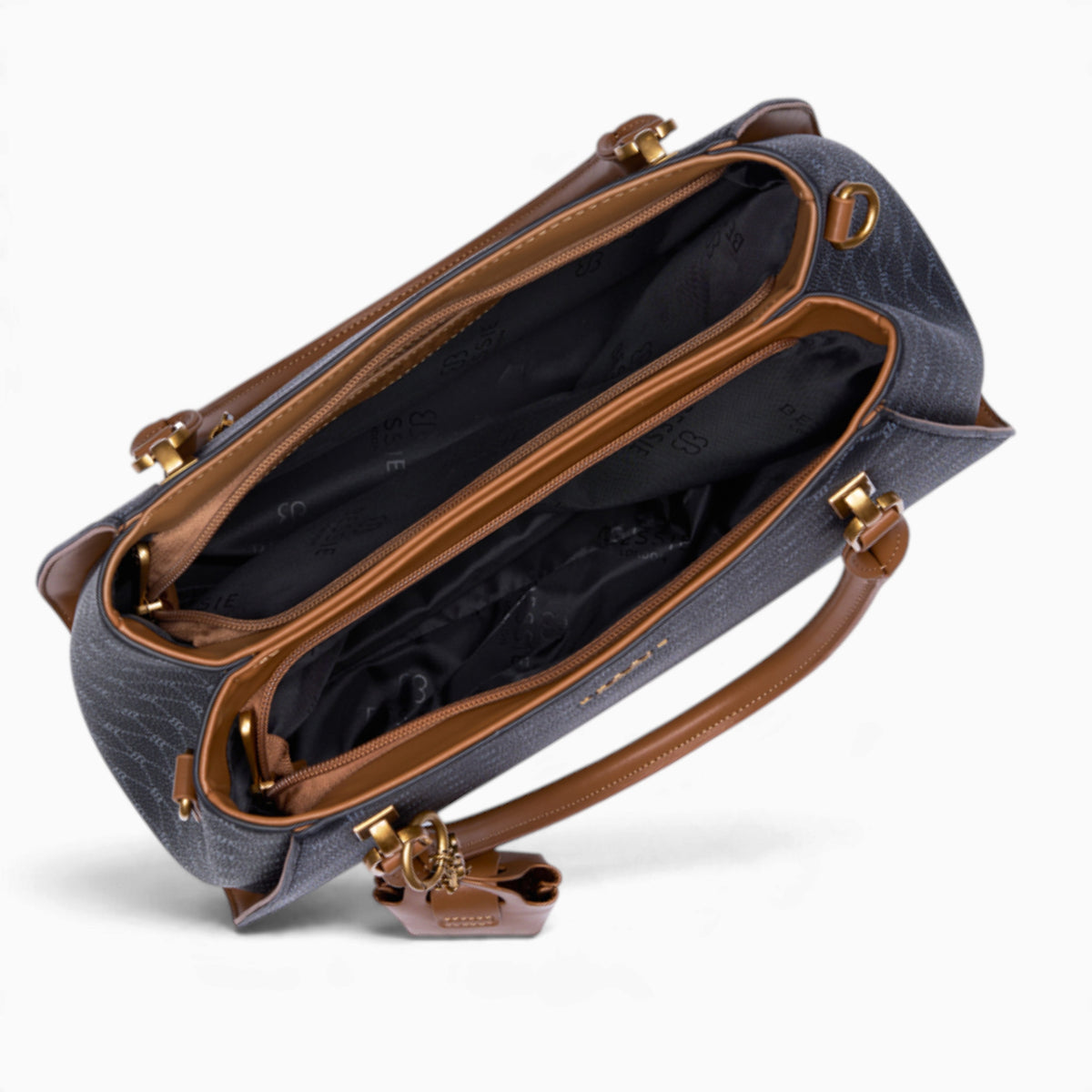 Black sculpted monogram tote bag opened to show the divided main compartment