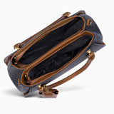 Black sculpted monogram tote bag opened to show the divided main compartment