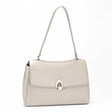 Abbey Stone single-strap flap shoulder bag with a flap-over front and gold-tone hardware
