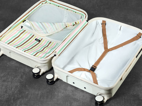 Vanilla Gelato suitcase opened to show the peach skin lining, wet pocket and packing straps