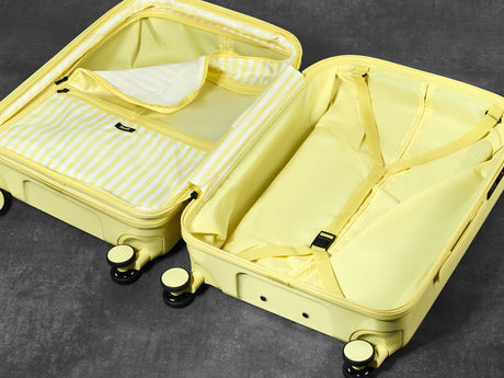 Lemon Ice Gelato suitcase opened to show the peach skin lining, wet pocket and packing straps