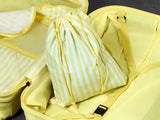 Lemon Ice Gelato suitcase, close-up of the matching striped laundry bag inside