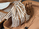 Chocolate Gelato suitcase, close-up of the matching striped laundry bag inside