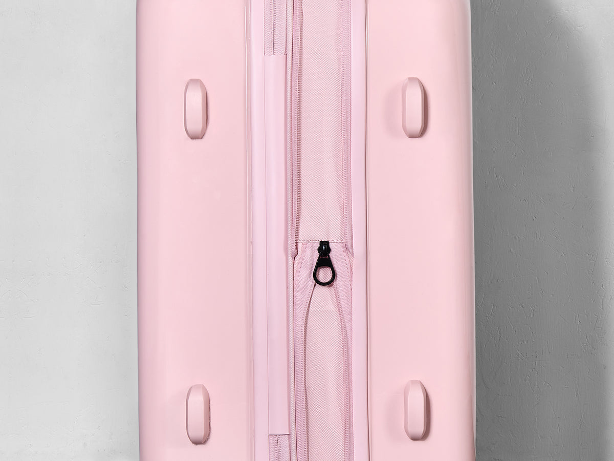 Strawberry Gelato suitcase, close-up of the expansion zip around the side