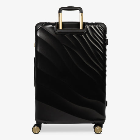 Moonlight Black Sahara large suitcase from the back, showing the trolley handle and back panel