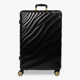 Moonlight Black Sahara large suitcase with a wave-design hard shell and 8 double spinner wheels