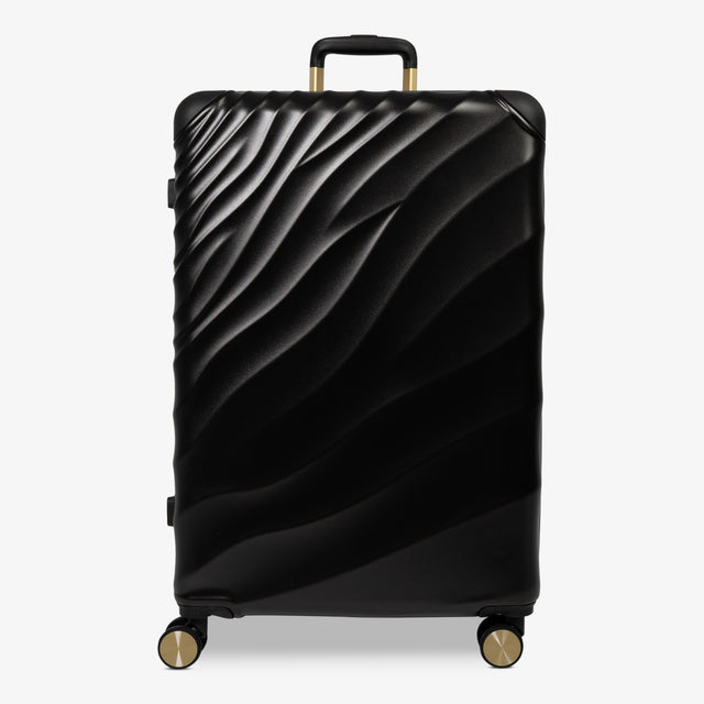 Moonlight Black Sahara large suitcase with a wave-design hard shell and 8 double spinner wheels