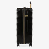 Moonlight Black Sahara large suitcase, side view showing the side handle and reinforced corners