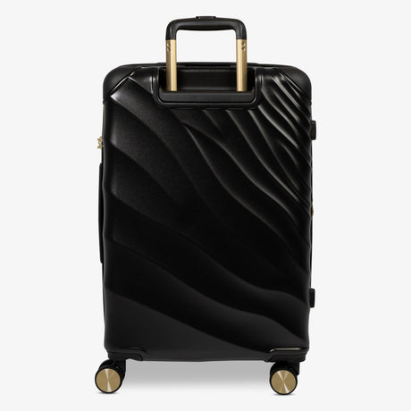 Moonlight Black Sahara medium suitcase from the back, showing the trolley handle and back panel