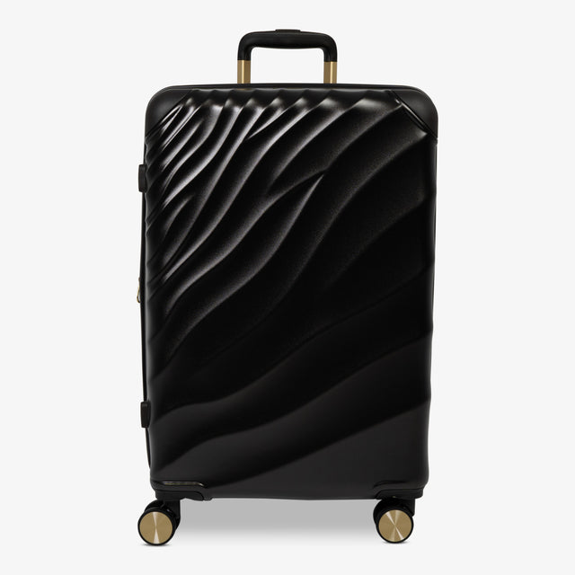 Moonlight Black Sahara medium suitcase with a wave-design hard shell and 8 double spinner wheels