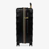 Moonlight Black Sahara medium suitcase, side view showing the side handle and reinforced corners