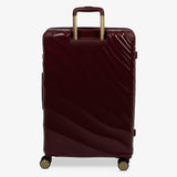 Burgundy Dusk Sahara large suitcase from the back, showing the trolley handle and back panel