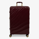 Burgundy Dusk Sahara large suitcase with a wave-design hard shell and 8 double spinner wheels