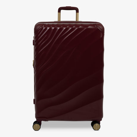 Burgundy Dusk Sahara large suitcase with a wave-design hard shell and 8 double spinner wheels