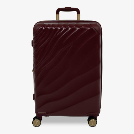 Burgundy Dusk Sahara medium suitcase with a wave-design hard shell and 8 double spinner wheels