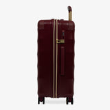 Burgundy Dusk Sahara medium suitcase, side view showing the side handle and reinforced corners