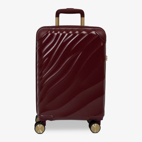 Burgundy Dusk Sahara cabin suitcase with a wave-design hard shell and 8 double spinner wheels