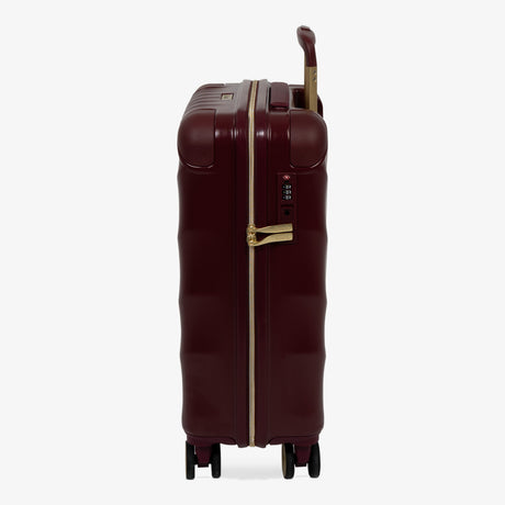 Burgundy Dusk Sahara cabin suitcase, side view showing the side handle and reinforced corners