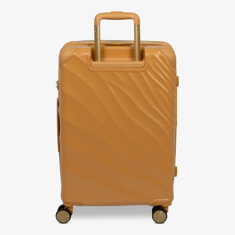 Gold Sunset Sahara medium suitcase from the back, showing the trolley handle and back panel