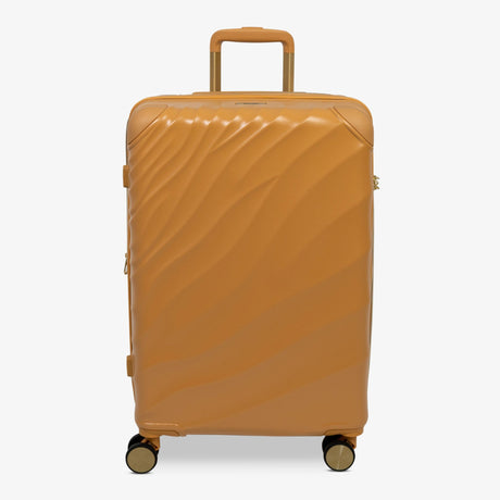 Gold Sunset Sahara medium suitcase with a wave-design hard shell and 8 double spinner wheels