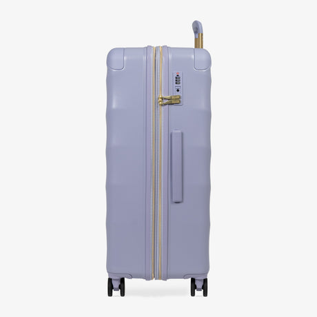 Lilac Sunrise Sahara large suitcase, side view showing the side handle and reinforced corners