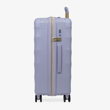 Lilac Sunrise Sahara medium suitcase, side view showing the side handle and reinforced corners