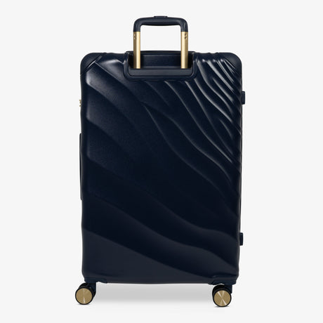 Midnight Navy Sahara large suitcase from the back, showing the trolley handle and back panel