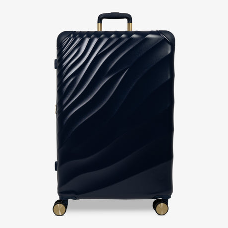 Midnight Navy Sahara large suitcase with a wave-design hard shell and 8 double spinner wheels