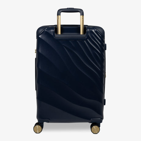 Midnight Navy Sahara medium suitcase from the back, showing the trolley handle and back panel