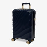 Midnight Navy Sahara cabin suitcase, angled view showing the wave-design shell