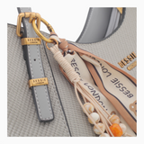 Bag Shack BESSIE LONDON textured grey hobo bag with gold hardware, decorative scarf charm, and beaded accents.
