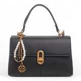 Bag Shack black faux leather compact handbag with gold lock detail, top handle, and decorative pearl charm