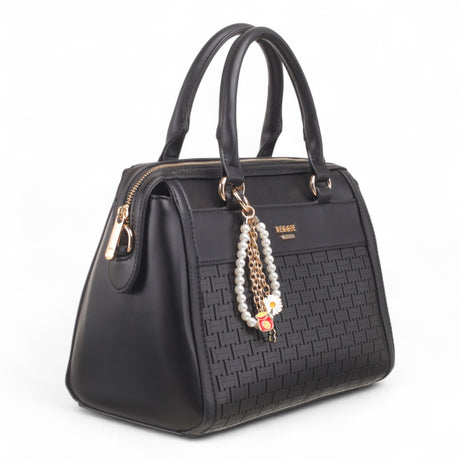 Bag Shack black faux leather handbag with woven front panel, gold hardware, and decorative pearl and flower charm.