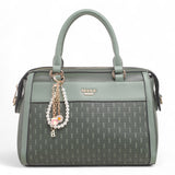 Bag Shack Bessie green faux leather handbag with woven front panel, gold hardware, and decorative pearl charm.