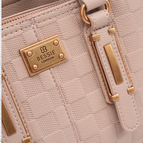 Khaki checkerboard tote bag, close-up of the embossed checkerboard and gold-tone logo