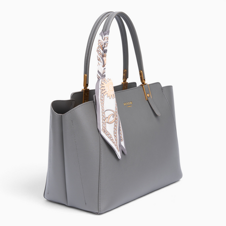 Grey faux leather tote bag, angled view showing the scarf detail and top handles