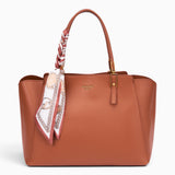 Bag Shack | Luggage, Bags, Handbags & Travel Accessories tan faux leather tote with a patterned scarf on the handle