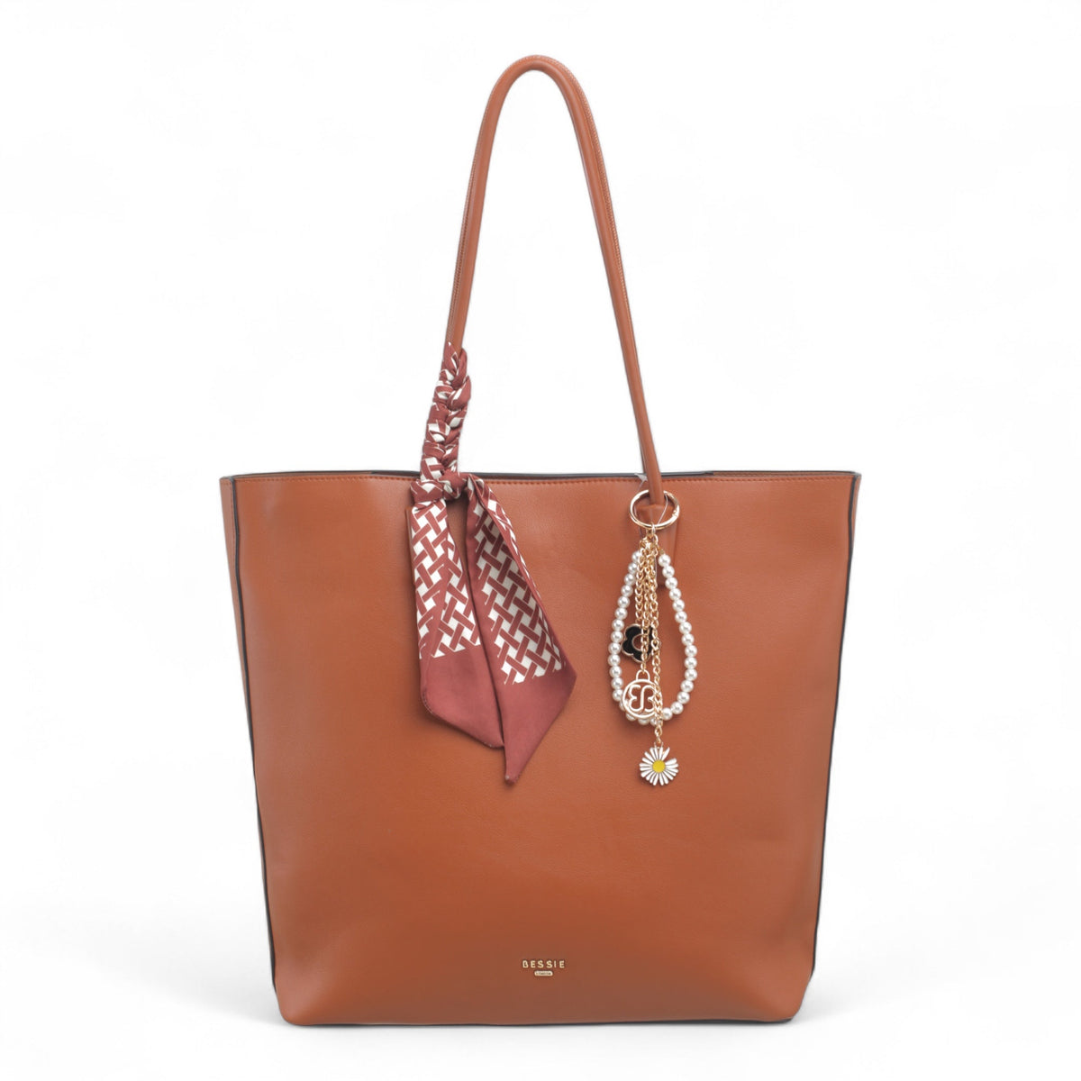 Bag Shack Bessie tan faux leather zip top tote bag featuring a decorative scarf and pearl charm detail